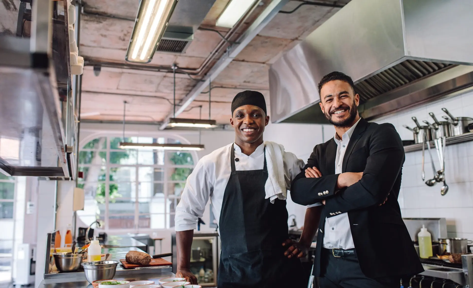 Restaurant owner and chef in a commercial kitchen