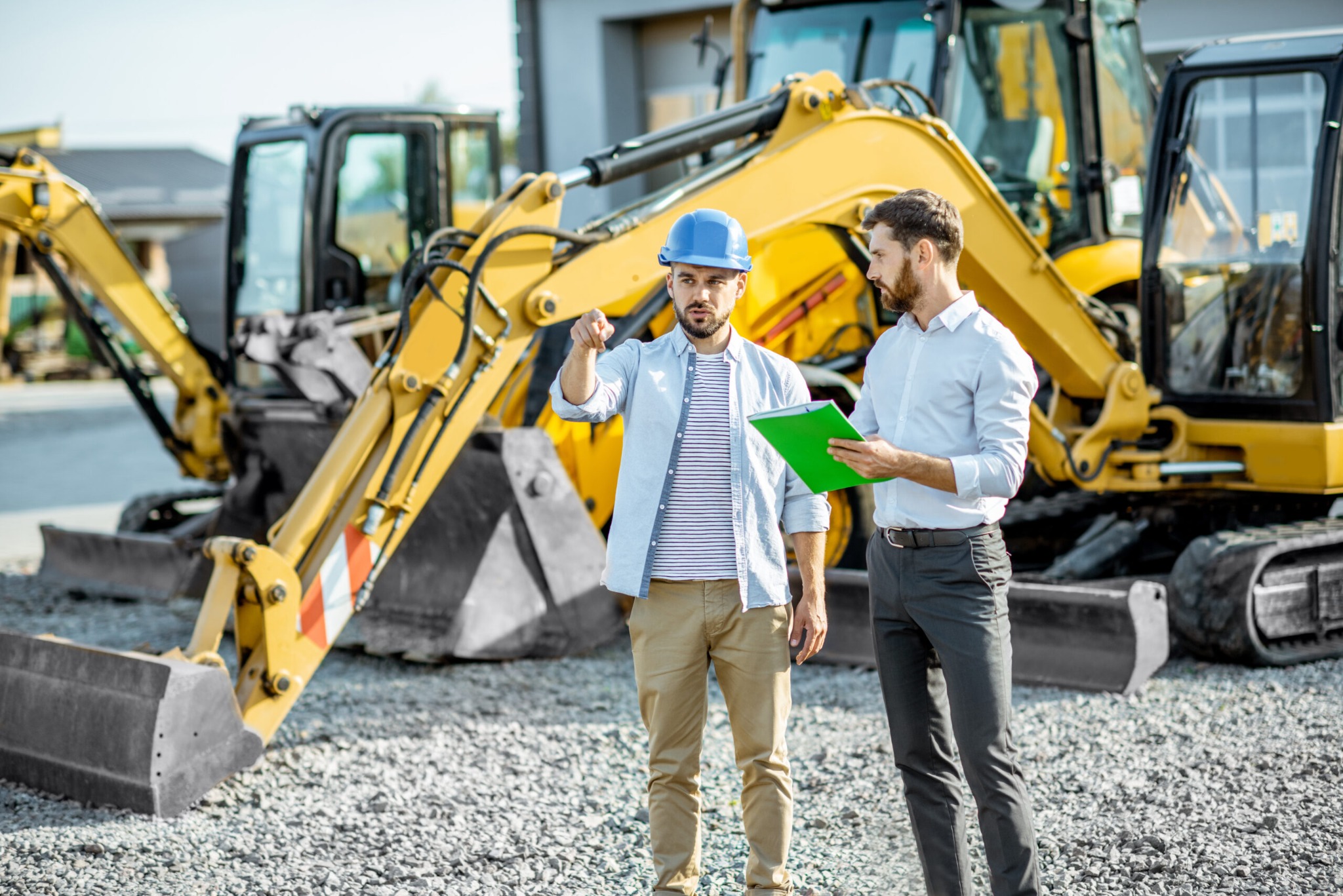 Construction professionals with heavy equipment