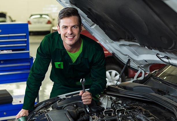 Auto repair technician working in a shop